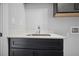 New laundry room with black cabinets and white countertop at 202 Dawson Dr, Woodstock, GA 30188