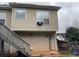Image showcasing the back exterior of the house with stairs leading up at 2175 Golden Valley Dr, Lawrenceville, GA 30043