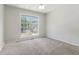 A well-lit bedroom with carpet and a large window offers a cozy and bright atmosphere at 2175 Golden Valley Dr, Lawrenceville, GA 30043