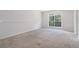 Bedroom with carpet and natural light offers an empty space at 2175 Golden Valley Dr, Lawrenceville, GA 30043