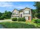 Beautiful exterior view of a home featuring an arched front door and driveway at 2175 Golden Valley Dr, Lawrenceville, GA 30043