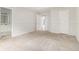 Carpeted main bedroom with en-suite bathroom and natural light at 2175 Golden Valley Dr, Lawrenceville, GA 30043