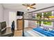Bedroom with bunk beds, desk, ceiling fan, and natural light from the window at 3488 Pebble Brook Ln, Stockbridge, GA 30281