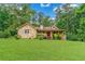 Charming home featuring stone accents, lush landscaping, and a well-manicured lawn at 3488 Pebble Brook Ln, Stockbridge, GA 30281