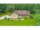 Beautiful home with dormer windows, complemented by lush landscaping and a well-maintained front yard at 3488 Pebble Brook Ln, Stockbridge, GA 30281