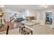 Bright and airy kitchen flowing into the living area, featuring granite counters and an open layout at 3488 Pebble Brook Ln, Stockbridge, GA 30281
