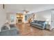 Cozy living room with a stone fireplace, hardwood floors, comfortable sofas, and plenty of natural light at 3488 Pebble Brook Ln, Stockbridge, GA 30281