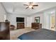 View of the main bedroom featuring a ceiling fan, a television, and neutral wall paint at 3488 Pebble Brook Ln, Stockbridge, GA 30281