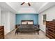 Tranquil main bedroom with a trey ceiling, a calming accent wall, and carpet flooring at 3488 Pebble Brook Ln, Stockbridge, GA 30281