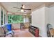 Screened porch with outdoor seating and views of the surrounding greenery, great for relaxation at 3488 Pebble Brook Ln, Stockbridge, GA 30281