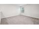 Versatile loft space with neutral walls, soft carpeting, and natural light from a window at 382 Daffodil Dr, Temple, GA 30179