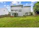 Spacious backyard featuring a well-maintained lawn and a charming deck, perfect for outdoor enjoyment at 570 White Stag Ct, Suwanee, GA 30024