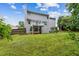 Lush backyard with a well-kept lawn, a deck, and partial fencing, ideal for outdoor gatherings at 570 White Stag Ct, Suwanee, GA 30024