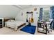 Bedroom boasts guitars, a desk by the window, light green walls, and a comfortable atmosphere at 570 White Stag Ct, Suwanee, GA 30024