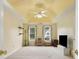 Spacious bedroom featuring a tray ceiling, neutral walls and dual windows for ample natural light at 570 White Stag Ct, Suwanee, GA 30024