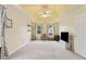 Light-filled bedroom showcasing neutral walls, a tray ceiling and dual windows with backyard views at 570 White Stag Ct, Suwanee, GA 30024
