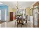 Formal dining room featuring a chandelier, bay window, and elegant furnishings at 570 White Stag Ct, Suwanee, GA 30024