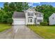 Charming two-story home with stone accents, well-manicured lawn, and a two-car garage at 570 White Stag Ct, Suwanee, GA 30024