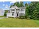 Charming two-story home with stone accents, well-manicured lawn, and a two-car garage at 570 White Stag Ct, Suwanee, GA 30024