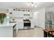 Kitchen view showcasing stainless steel appliances, sleek countertops, and ample cabinet space at 570 White Stag Ct, Suwanee, GA 30024