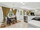 Eat-in kitchen with tile floors, stainless steel appliances and large windows overlooking the backyard at 570 White Stag Ct, Suwanee, GA 30024