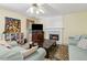 Comfortable living room featuring a fireplace, tv, and cozy seating at 570 White Stag Ct, Suwanee, GA 30024