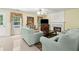 Cozy living room featuring a fireplace, comfortable seating, and an open layout at 570 White Stag Ct, Suwanee, GA 30024