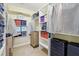 Well-organized walk-in closet with custom shelving and ample storage space at 570 White Stag Ct, Suwanee, GA 30024