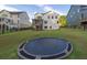 A very large yard with fencing and trampoline, located behind a beautiful home at 401 Pirkle Ave, Buford, GA 30518