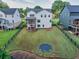 Expansive backyard featuring lush lawn and a built-in trampoline, perfect for outdoor enjoyment at 401 Pirkle Ave, Buford, GA 30518