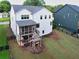 A cozy screened in porch and deck offers comfortable seating with stairs leading to a well-maintained backyard at 401 Pirkle Ave, Buford, GA 30518