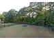 Expansive backyard enclosed by a sleek black fence, providing privacy and security at 401 Pirkle Ave, Buford, GA 30518