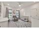 Bright Bedroom with grey rug, crib, comfy armchair, and plenty of natural light at 401 Pirkle Ave, Buford, GA 30518