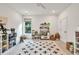 Bright bedroom featuring a ceiling fan, ample natural light, and playful decor at 401 Pirkle Ave, Buford, GA 30518