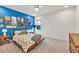 Stylish bedroom showcases vibrant blue accent wall with eclectic decor and natural light at 401 Pirkle Ave, Buford, GA 30518