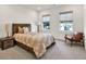 Comfortable bedroom with two windows with shades and hardwood furniture at 401 Pirkle Ave, Buford, GA 30518