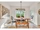 Dining room with a wooden table, stylish lighting, and a view of the outdoors at 401 Pirkle Ave, Buford, GA 30518