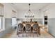 Elegant dining room with a large table, stylish chandelier, and views into other living spaces at 401 Pirkle Ave, Buford, GA 30518
