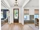 Inviting foyer with hardwood floors, stylish lighting, and a view into the adjacent living spaces at 401 Pirkle Ave, Buford, GA 30518