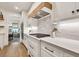 Modern kitchen with a gas cooktop, white cabinets, and sleek countertops at 401 Pirkle Ave, Buford, GA 30518