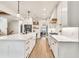 Bright kitchen with an island, pendant lights, and an open layout connecting to the dining area at 401 Pirkle Ave, Buford, GA 30518