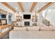 Bright living room with wood beams, a fireplace, and comfortable seating, creating a welcoming atmosphere at 401 Pirkle Ave, Buford, GA 30518
