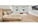 Bright main bedroom featuring a large bed, sitting area and natural light at 401 Pirkle Ave, Buford, GA 30518