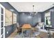 Comfortable home office with dark blue walls, natural light, and seating areas for work or relaxation at 401 Pirkle Ave, Buford, GA 30518