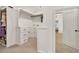 Well-organized walk-in closet with custom shelves, drawers, and cabinets for storage at 401 Pirkle Ave, Buford, GA 30518