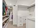 Spacious walk-in closet with built-in storage solutions and open shelving at 401 Pirkle Ave, Buford, GA 30518