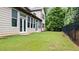 Spacious backyard featuring a black iron fence at 2040 Bloomfield Ct, Cumming, GA 30041