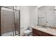 Bathroom with tile shower, granite vanity, and a large mirror at 2040 Bloomfield Ct, Cumming, GA 30041