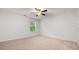 Bedroom featuring plush carpet, a ceiling fan, and a window providing natural light at 2040 Bloomfield Ct, Cumming, GA 30041