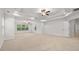 Large primary bedroom with tray ceilings, recessed lighting, and multiple windows at 2040 Bloomfield Ct, Cumming, GA 30041